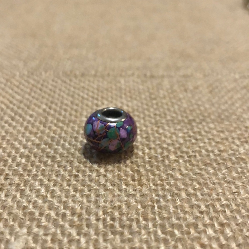 Charm for a charm bracelet